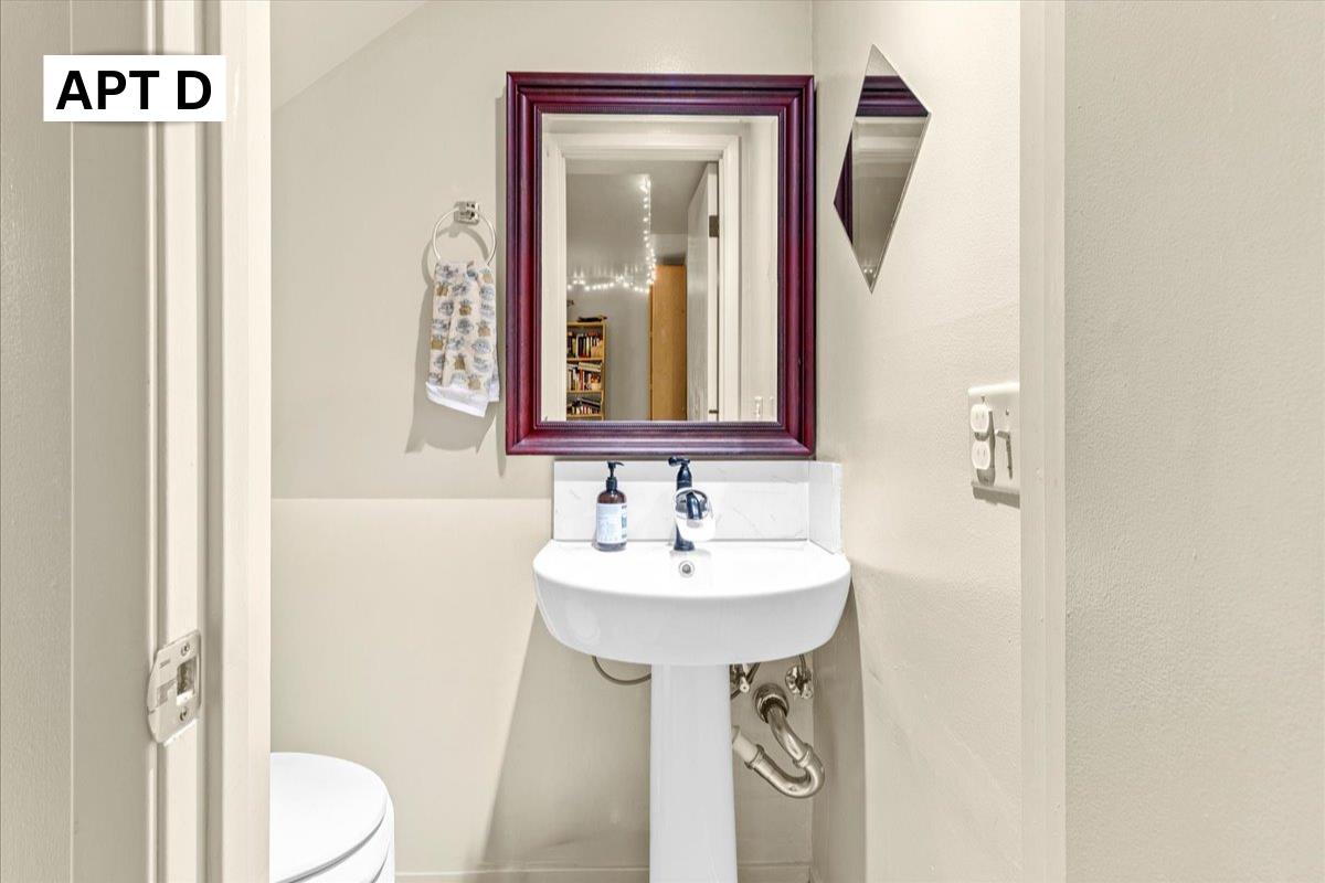 618 Forest Avenue Pacific Grove, CA 93950 - Photo 47 of 78 a bathroom with a sink and a mirror