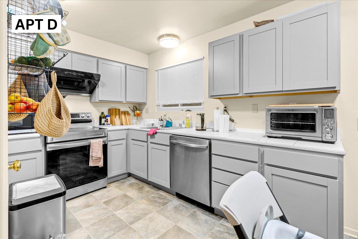 618 Forest Avenue Pacific Grove, CA 93950 - Photo 49 of 78 a kitchen with a sink cabinets and appliances
