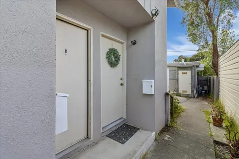 a bathroom with a sink mirror and toilet