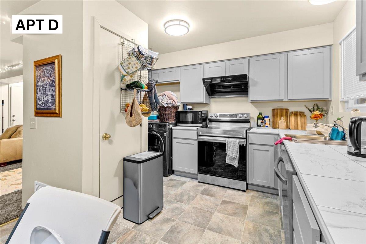 618 Forest Avenue Pacific Grove, CA 93950 - Photo 51 of 78 a kitchen with a stove and a refrigerator