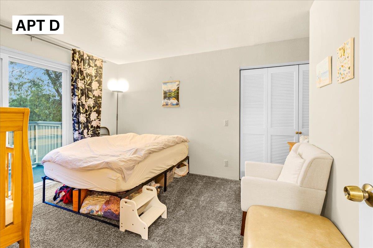 618 Forest Avenue Pacific Grove, CA 93950 - Photo 53 of 78 a spacious bedroom with a bed and a couch