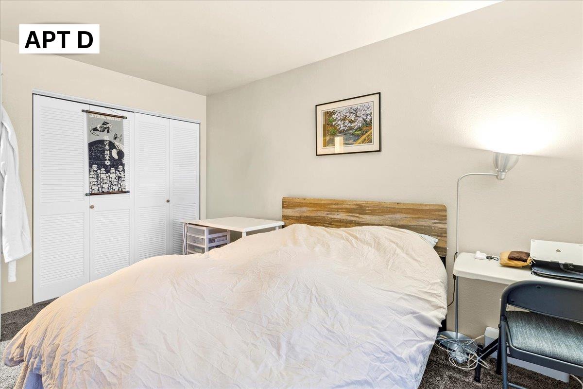 618 Forest Avenue Pacific Grove, CA 93950 - Photo 57 of 78 a bedroom with a bed and a desk