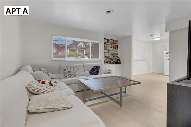 a bedroom with a bed and a table in it