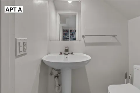 a bedroom with a bed and a walk in closet