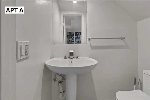 a bedroom with a bed and a walk in closet