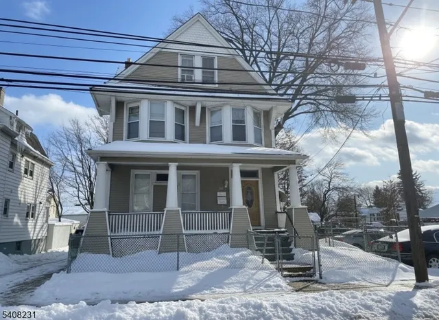 a front view of a house with a porch