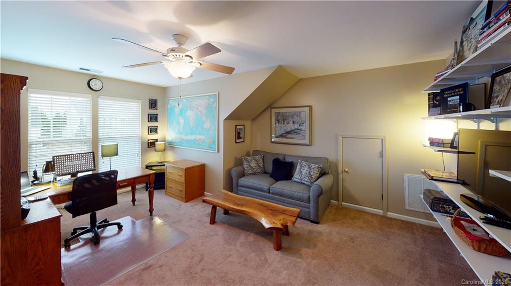 721 Warwick Way Fort Mill, SC 29708 - Photo 22 of 32 a living room with furniture and a flat screen tv