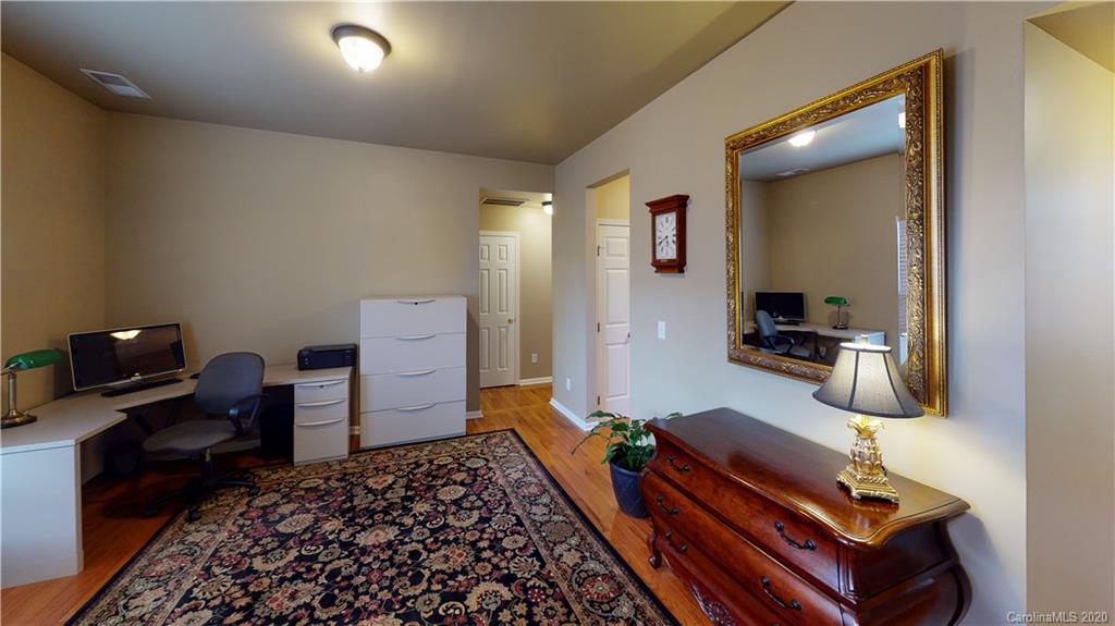 721 Warwick Way Fort Mill, SC 29708 - Photo 4 of 32 a bed room with a bed and a television