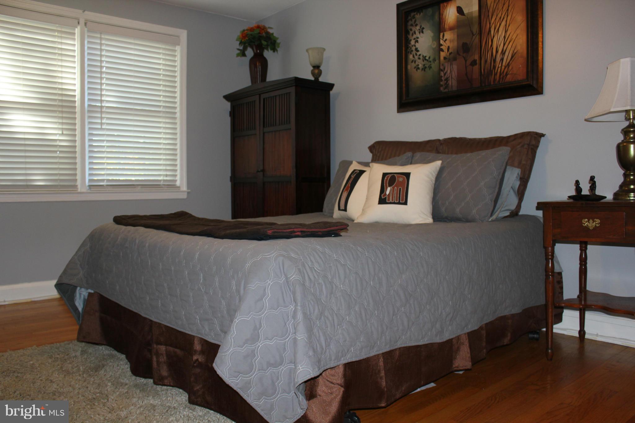 338 Dumbarton Road Baltimore, MD 21212 - Photo 14 of 30 a bedroom with bed and window