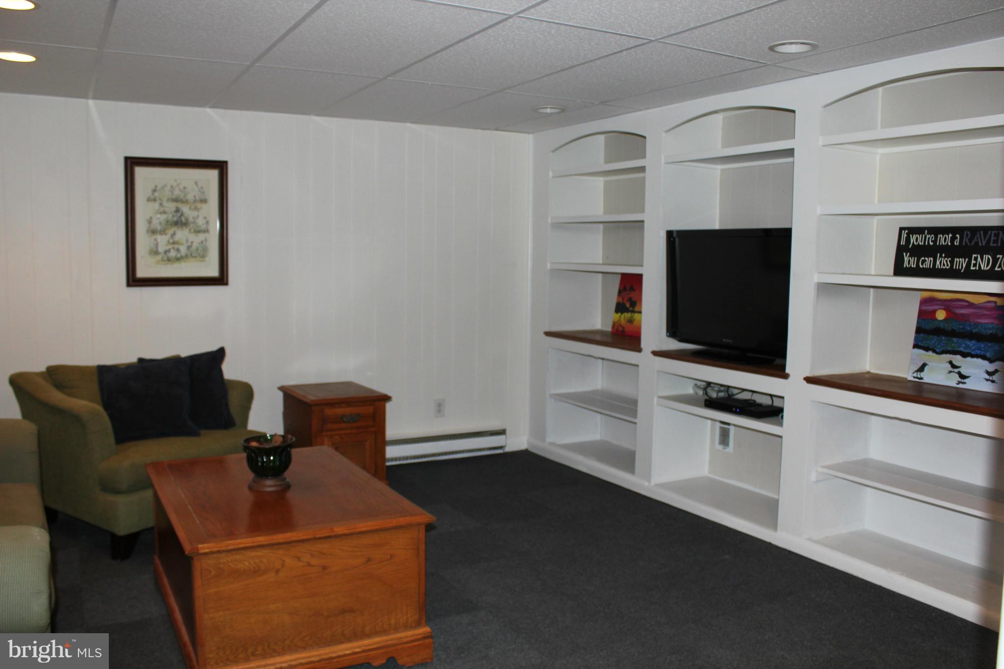 338 Dumbarton Road Baltimore, MD 21212 - Photo 25 of 30 a living room with furniture and a flat screen tv