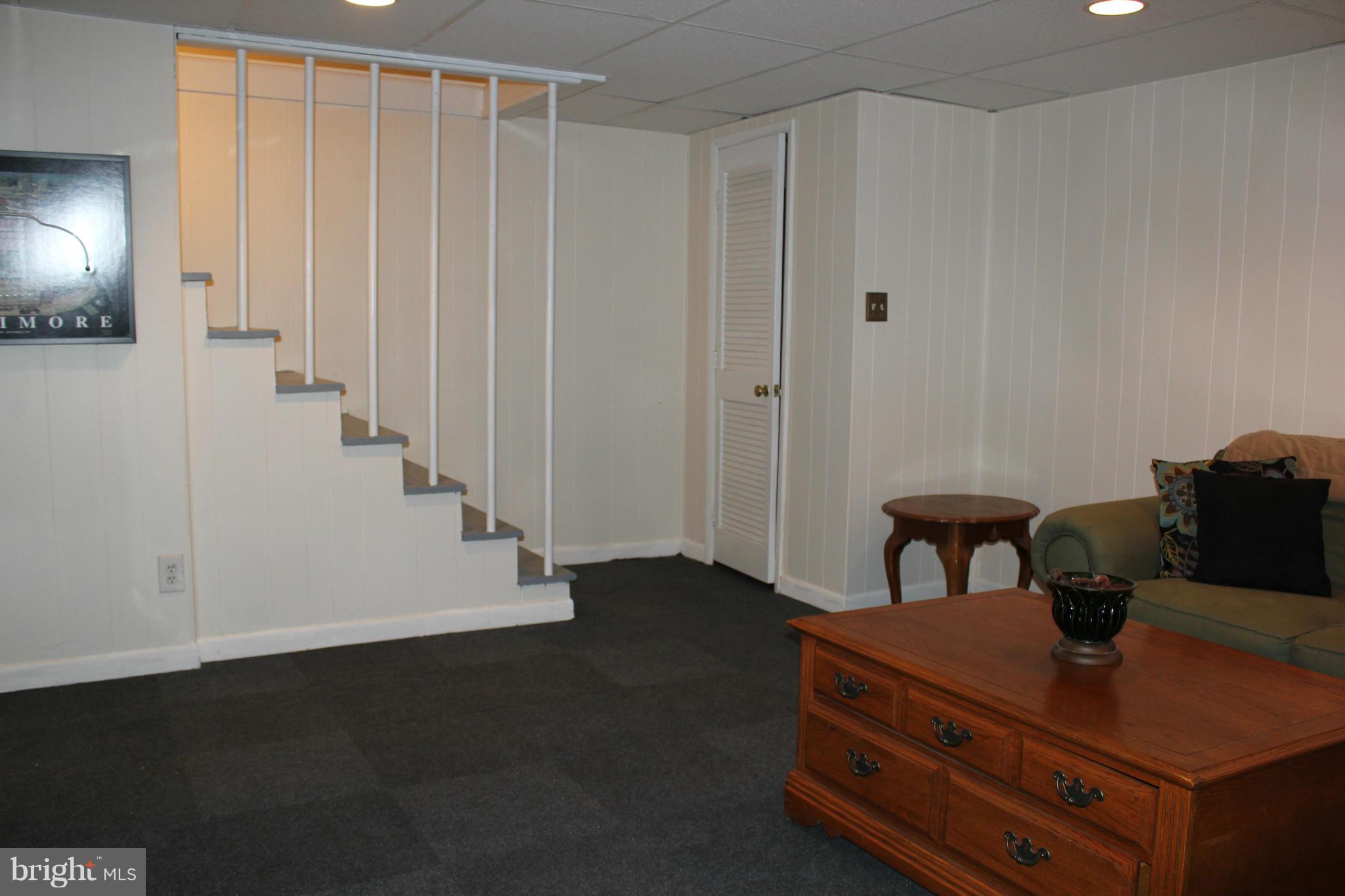 338 Dumbarton Road Baltimore, MD 21212 - Photo 26 of 30 a view of a livingroom with furniture and staircase