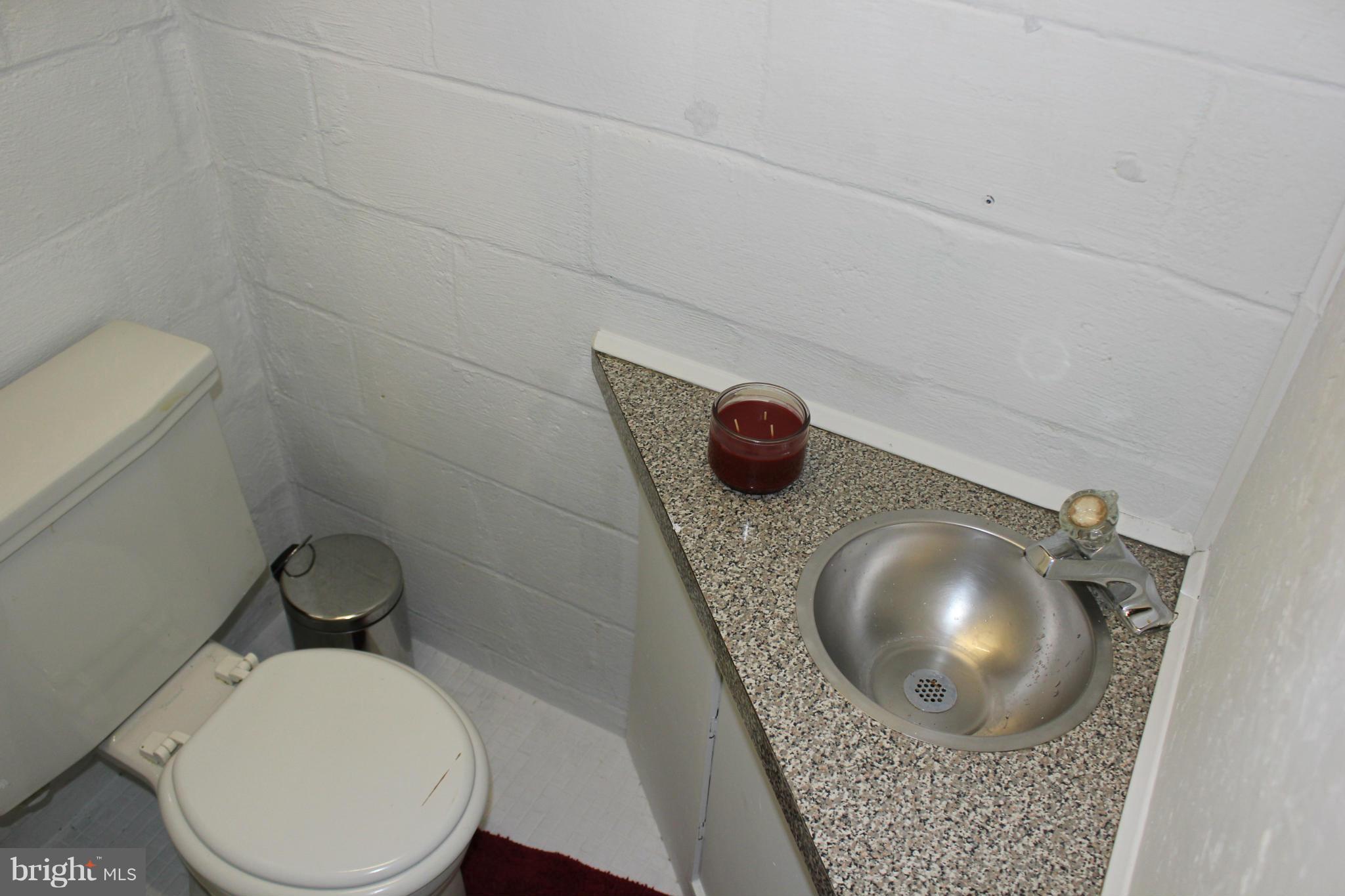 338 Dumbarton Road Baltimore, MD 21212 - Photo 27 of 30 a bathroom with a toilet and a sink