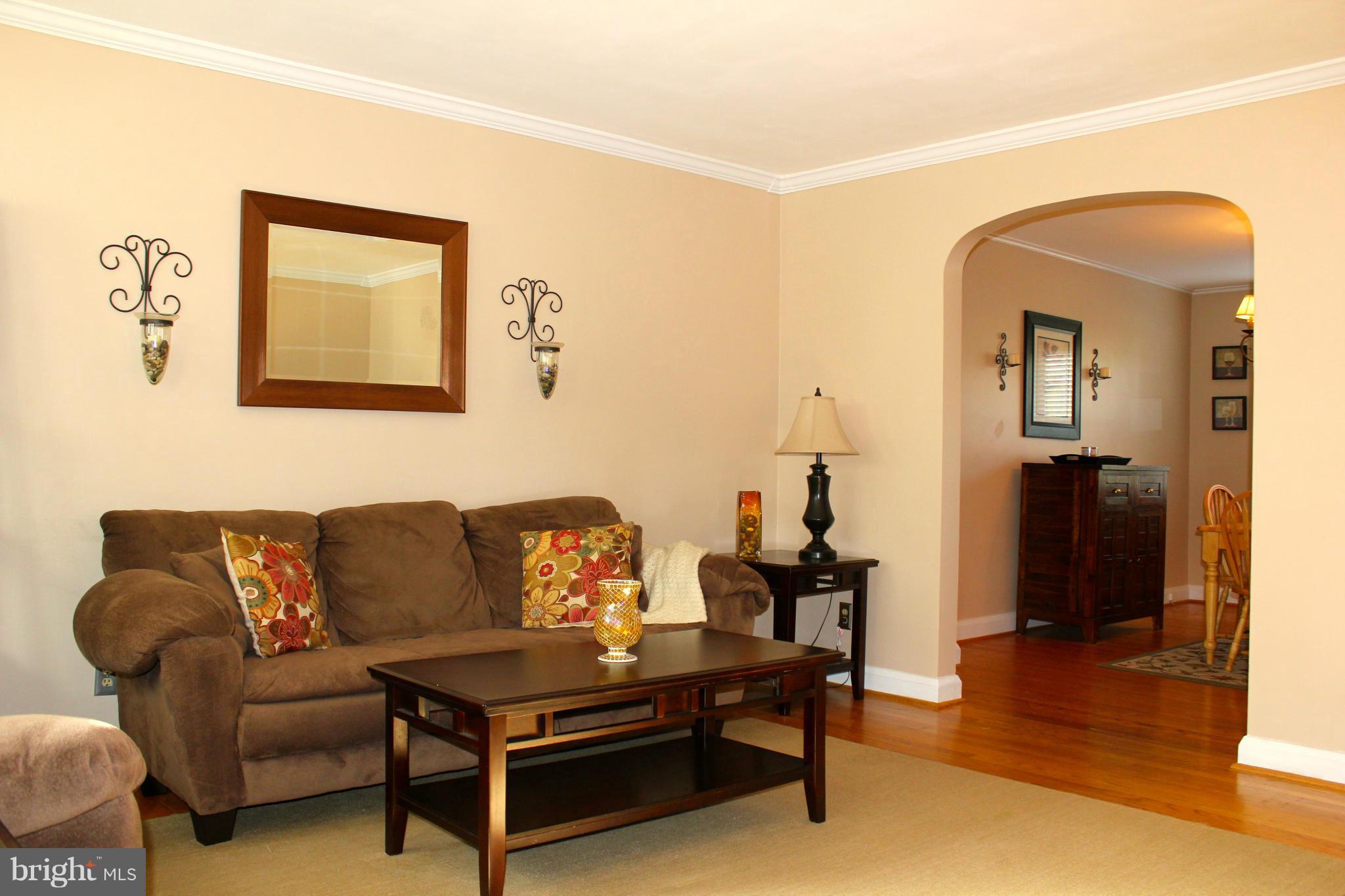 338 Dumbarton Road Baltimore, MD 21212 - Photo 5 of 30 a living room with furniture and a wooden floor