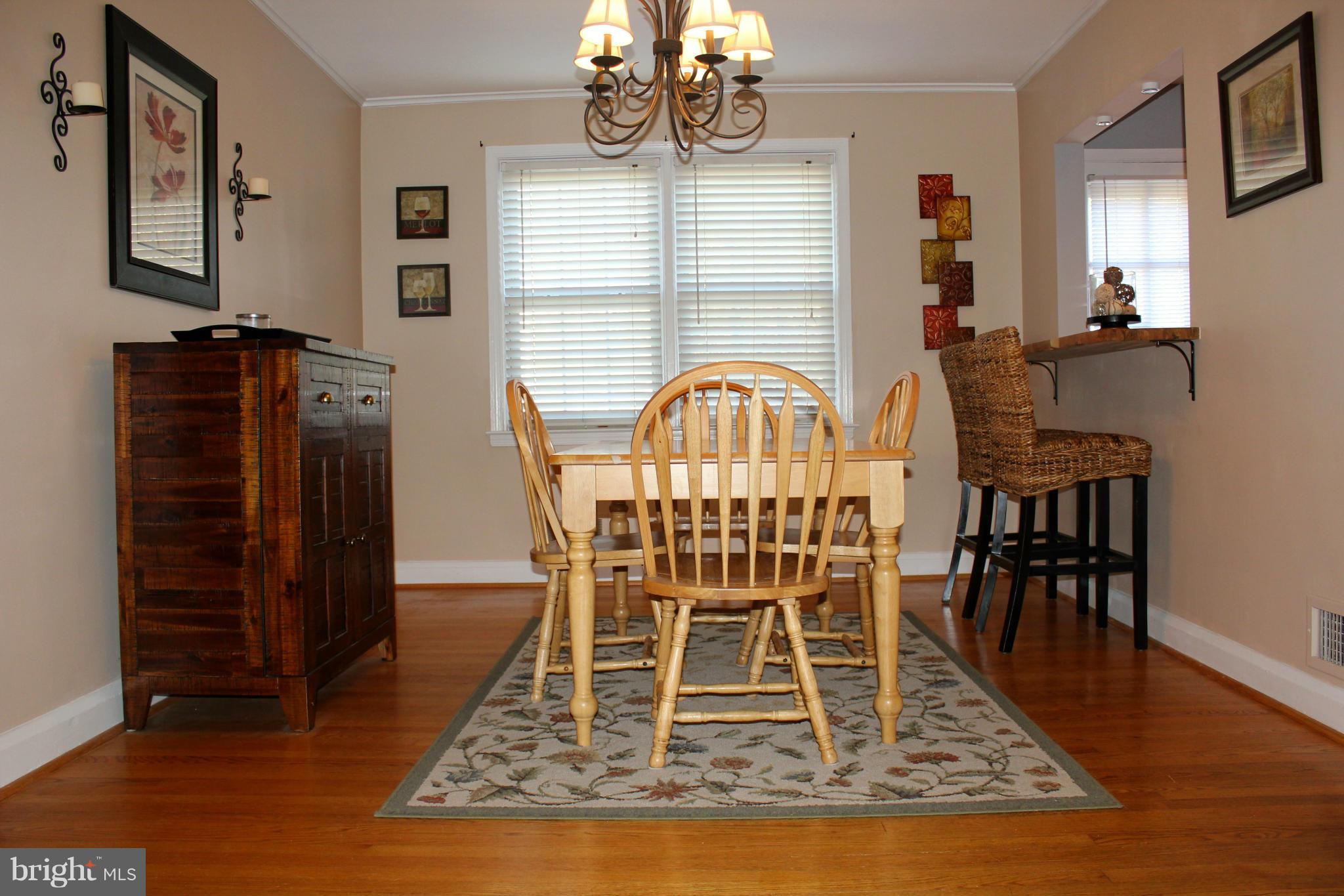 338 Dumbarton Road Baltimore, MD 21212 - Photo 6 of 30 a view of a dining room with furniture window and wooden floor