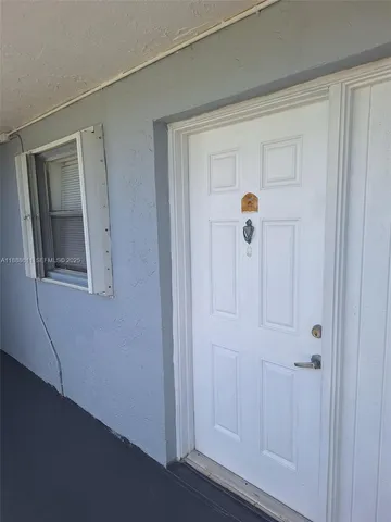 a hallway with sliding door and windows
