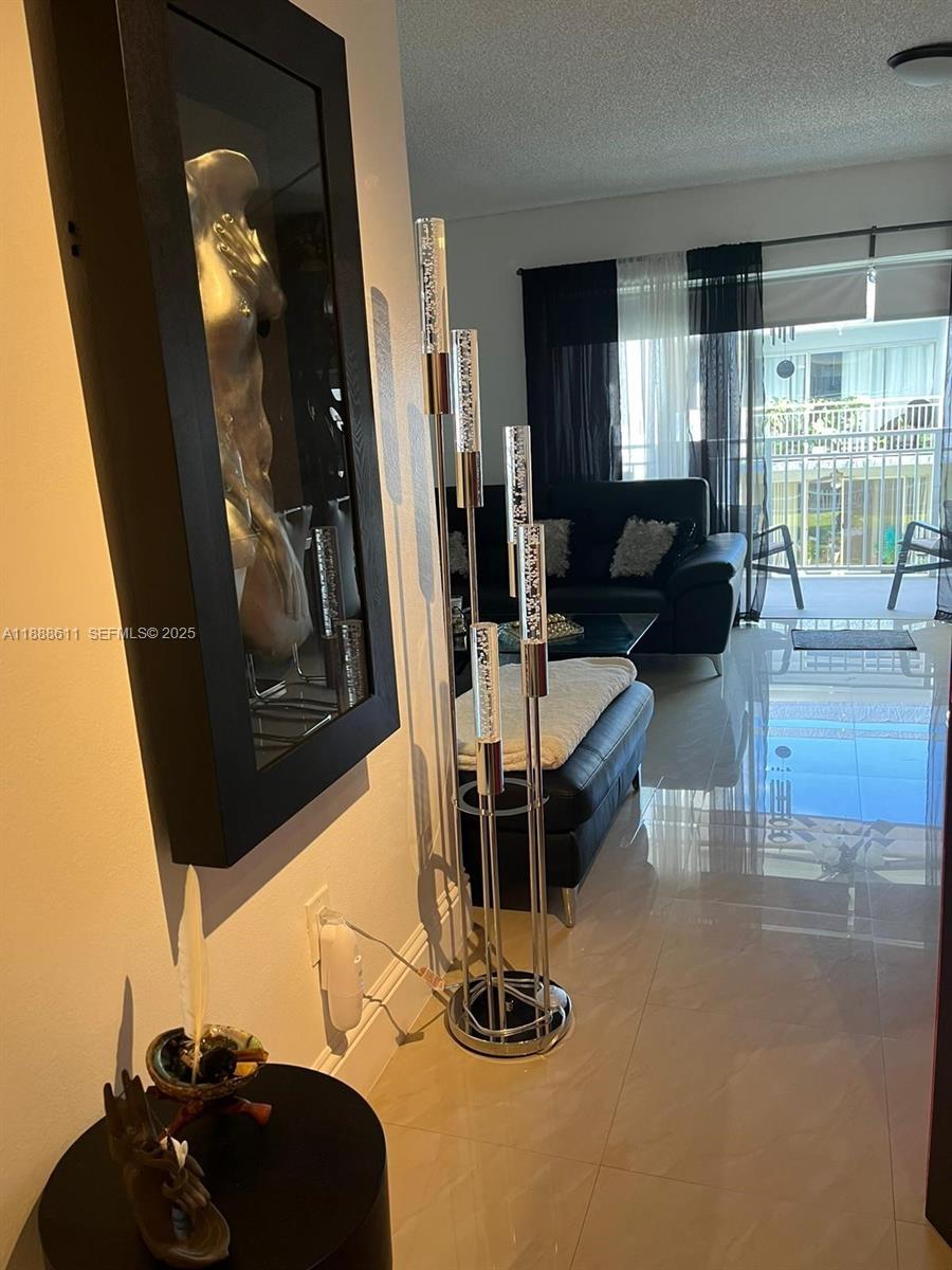 9375 Fontainebleau Boulevard, Unit L219 Miami, FL 33172 - Photo 5 of 13 a view of a room with gym equipment