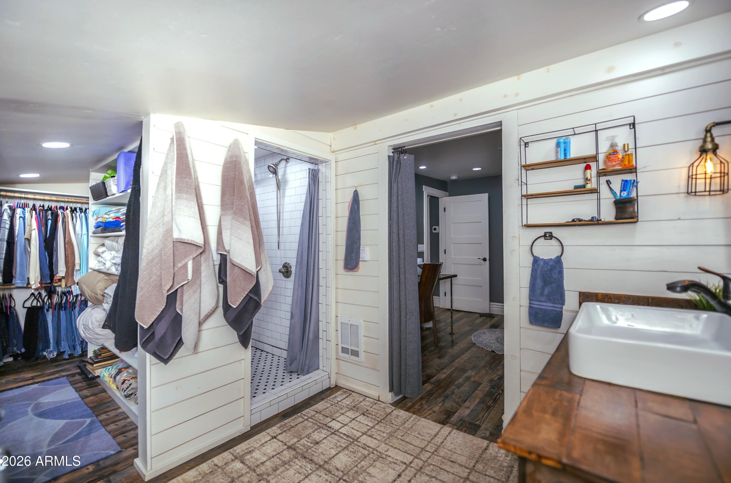 912 West Summit Street Payson, AZ 85541 - Photo 12 of 30 a view of walk in closet with clothes and shoes