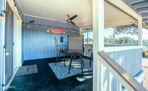 a view of a balcony with furniture