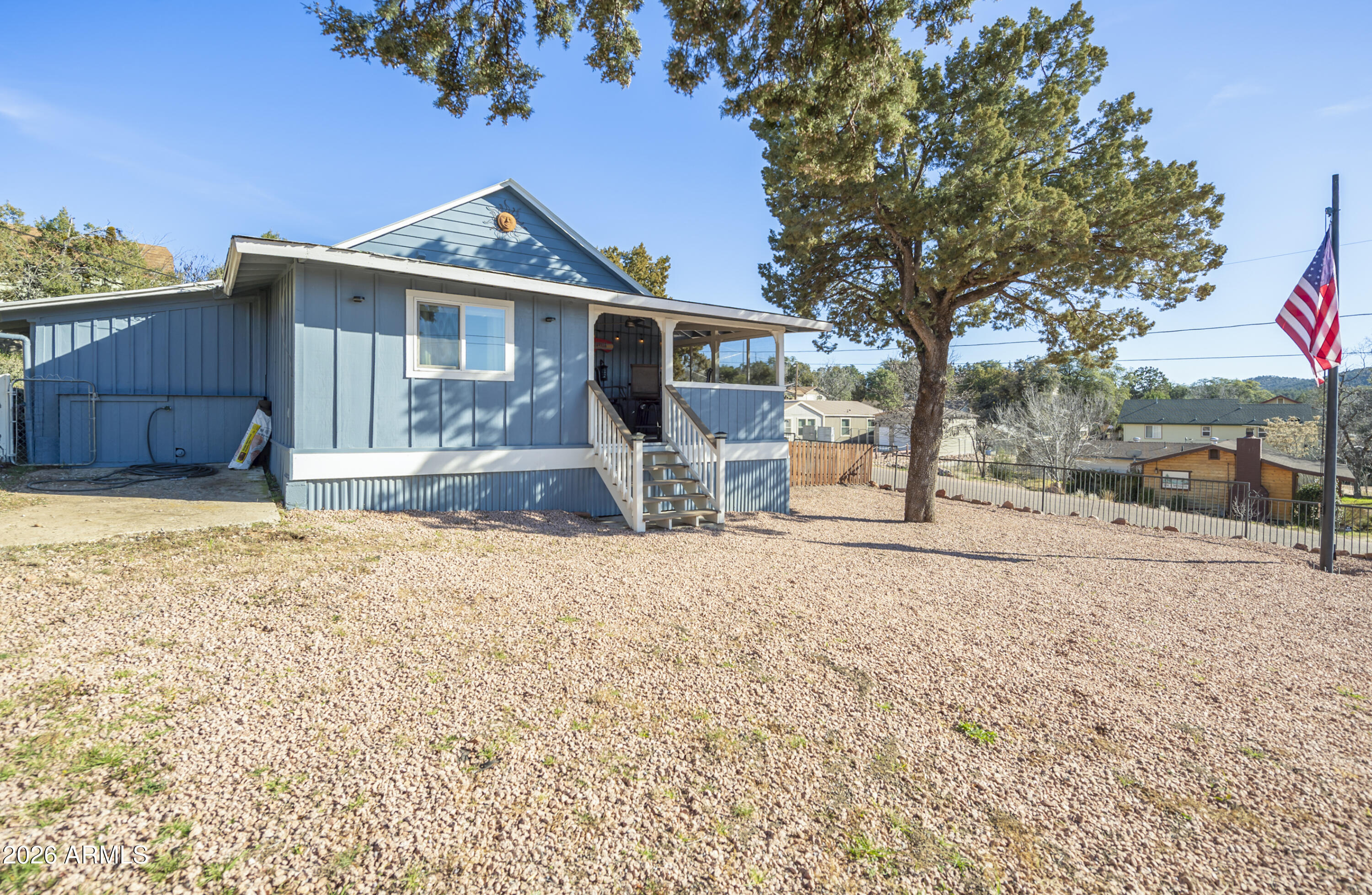 912 West Summit Street Payson, AZ 85541 - Photo 17 of 29 a front view of a house with a yard covered in snow