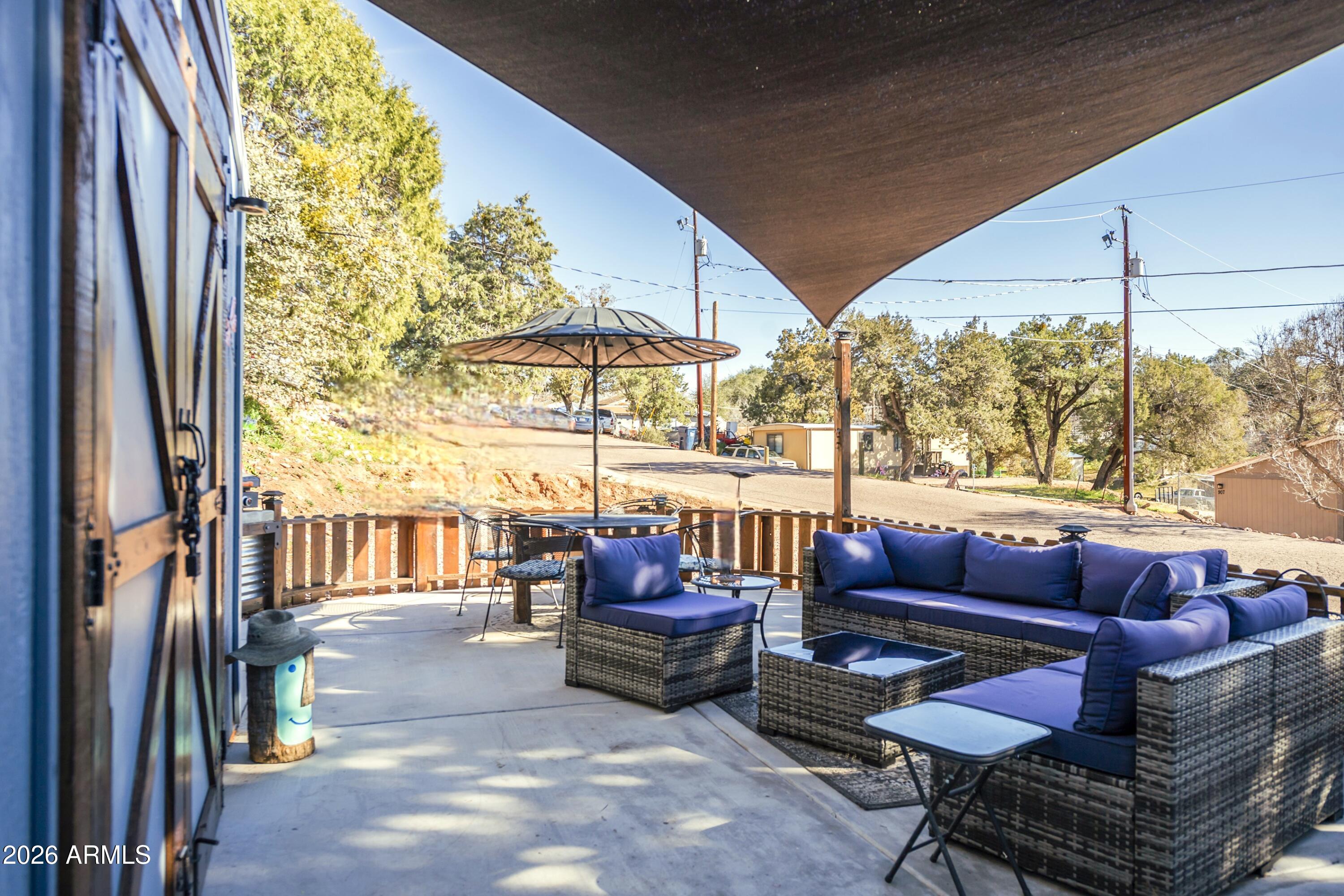 912 West Summit Street Payson, AZ 85541 - Photo 25 of 29 a outdoor space with patio couch and a potted plant