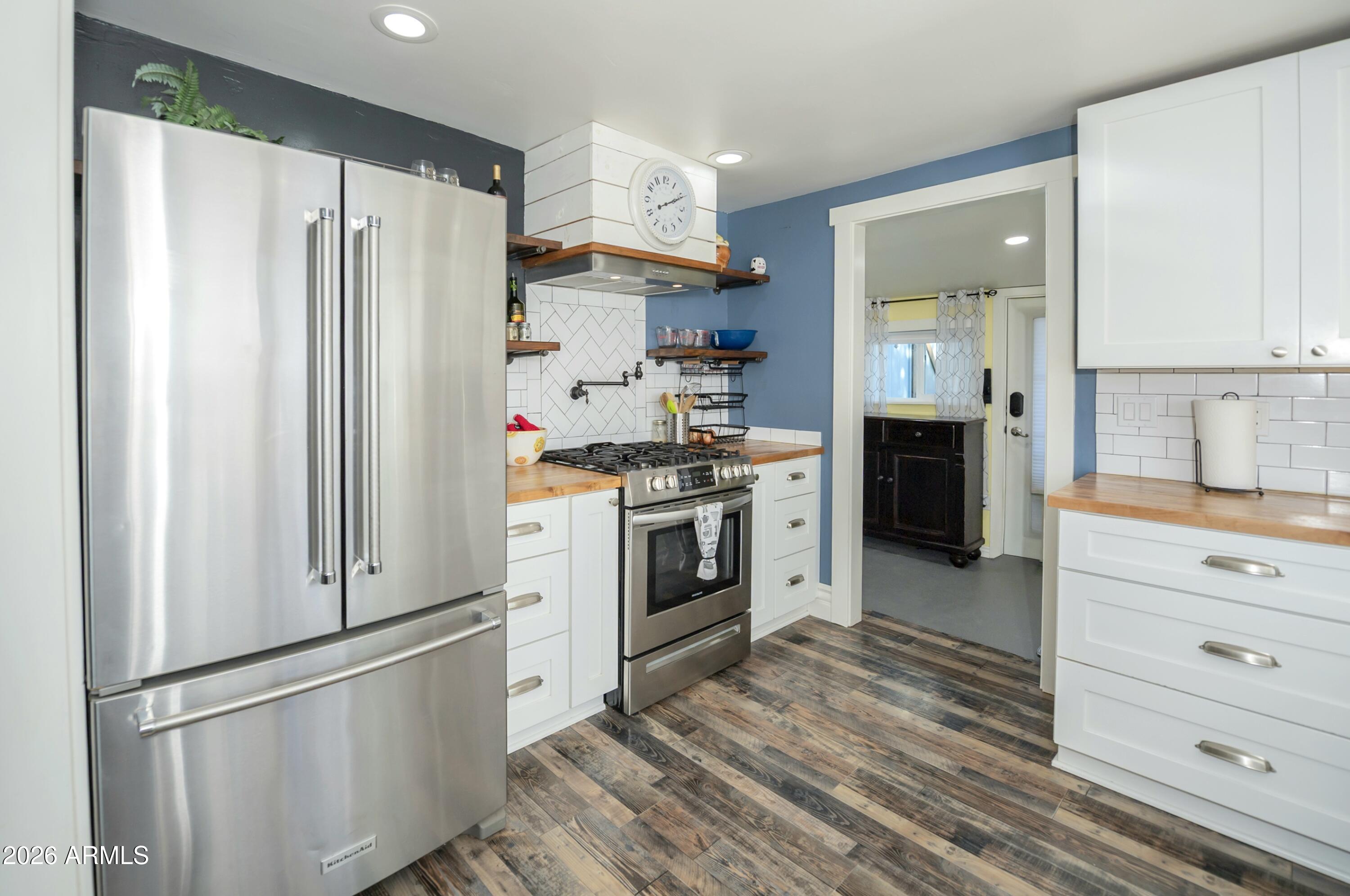 912 West Summit Street Payson, AZ 85541 - Photo 6 of 29 a kitchen with stainless steel appliances a refrigerator stove and sink