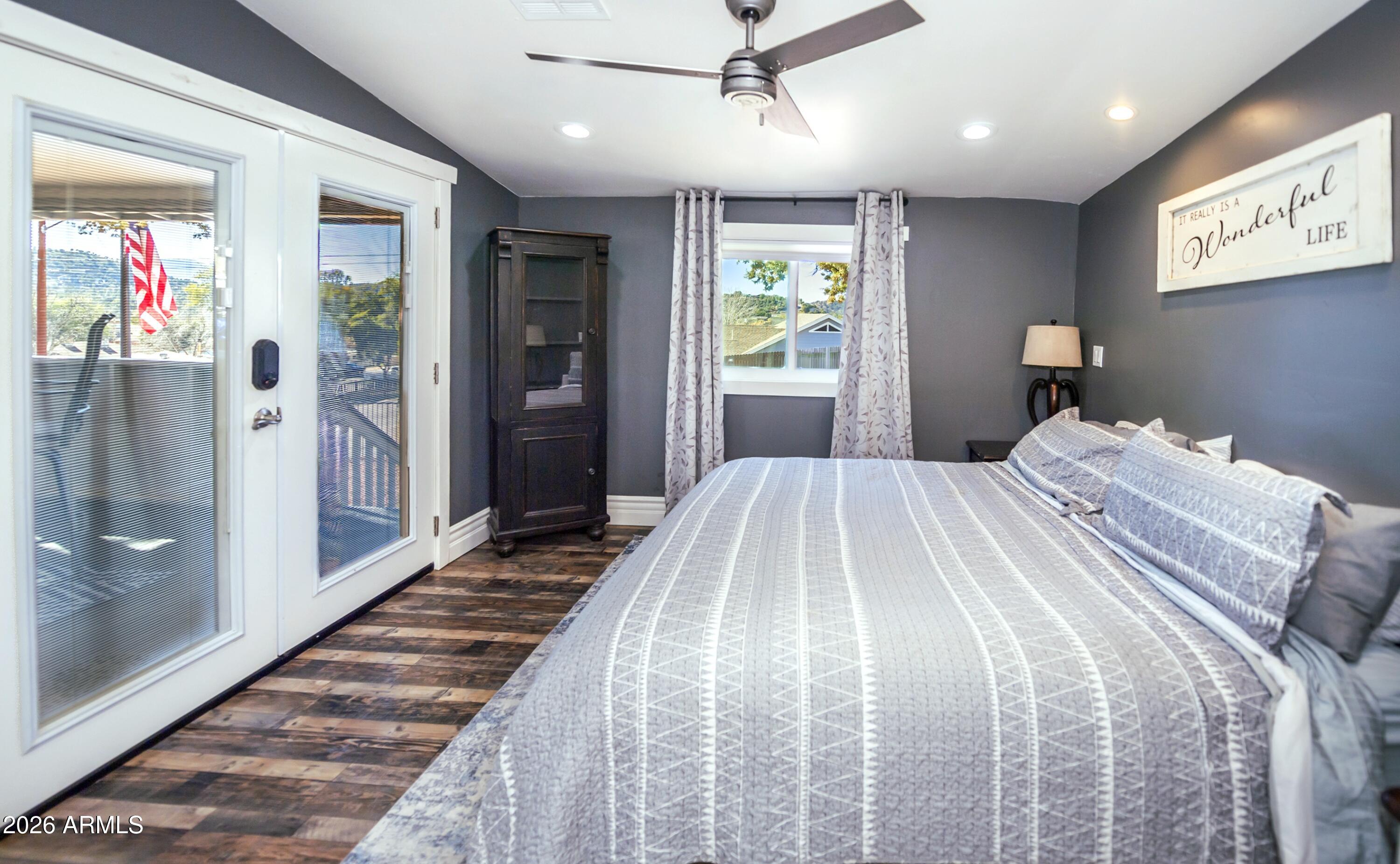 912 West Summit Street Payson, AZ 85541 - Photo 10 of 30 a bedroom with a bed and glass door