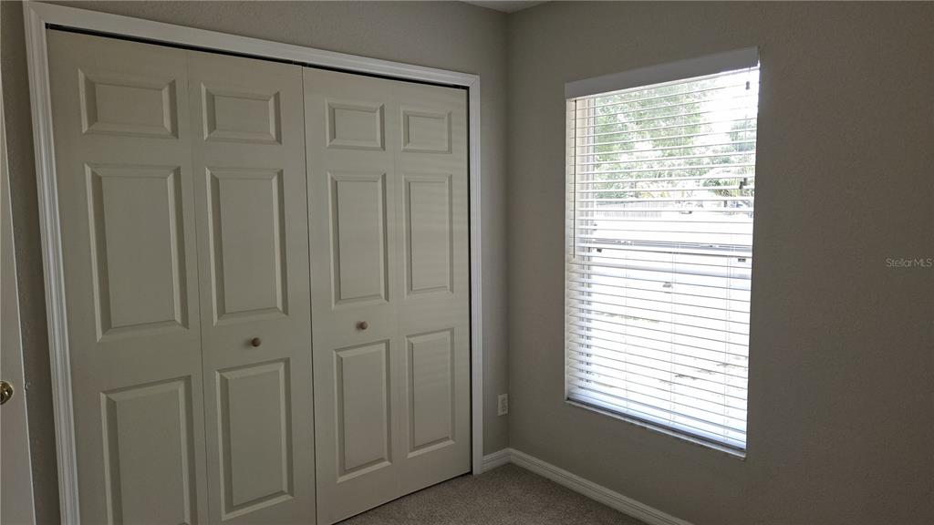 108 Brittany Road Mascotte, FL 34753 - Photo 8 of 17 a view of a closet with window