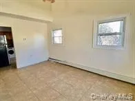 a bedroom with bed and window