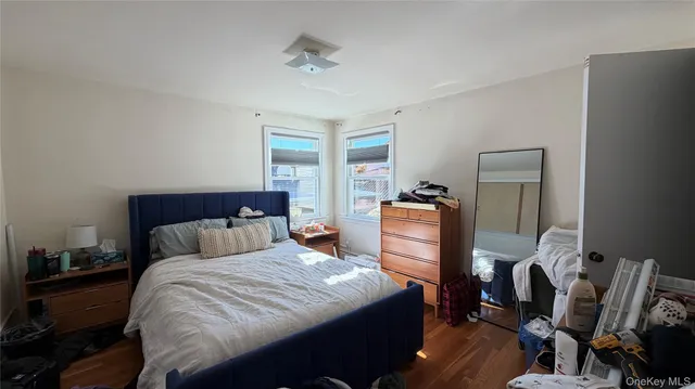 a bathroom with a sink toilet and a mirror