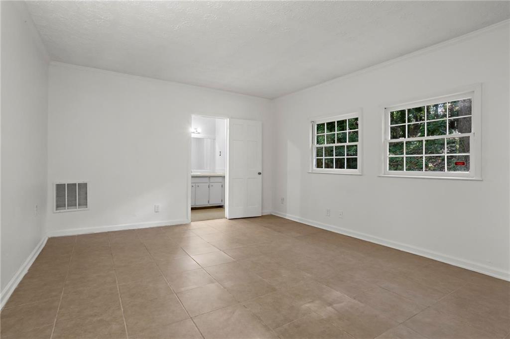 317 Argus Circle Northwest Atlanta, GA 30331 - Photo 14 of 21 an empty room with windows