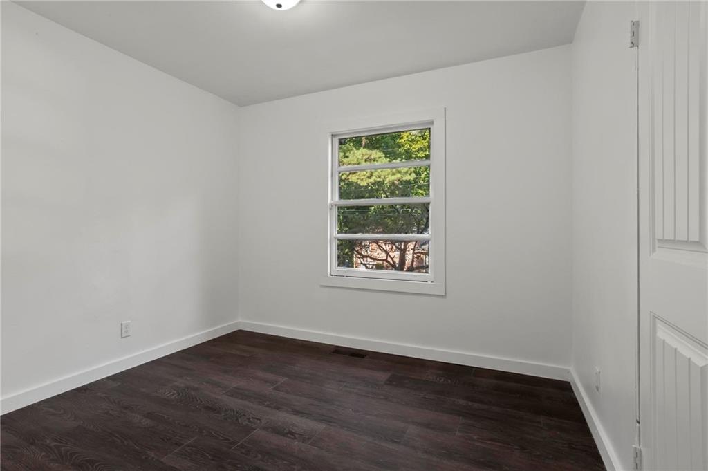 317 Argus Circle Northwest Atlanta, GA 30331 - Photo 20 of 21 an empty room with wooden floor and window