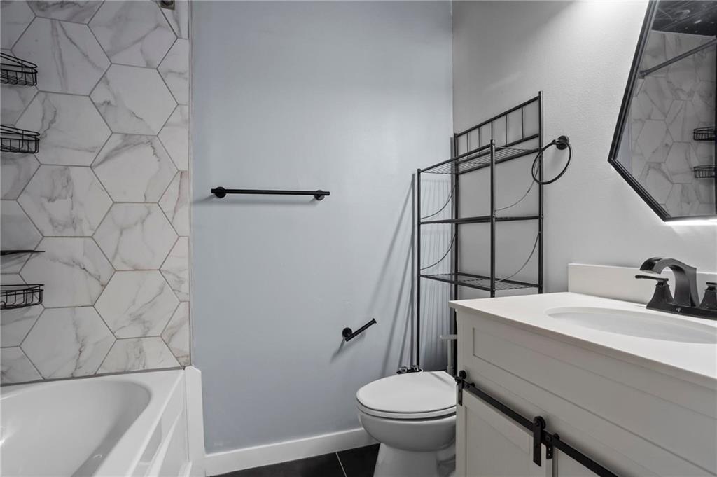 317 Argus Circle Northwest Atlanta, GA 30331 - Photo 21 of 21 a bathroom with a sink toilet and shower