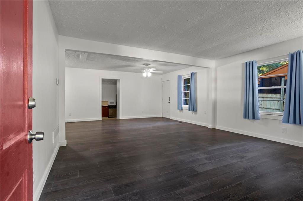 317 Argus Circle Northwest Atlanta, GA 30331 - Photo 4 of 21 a view of an empty room with window and wooden floor