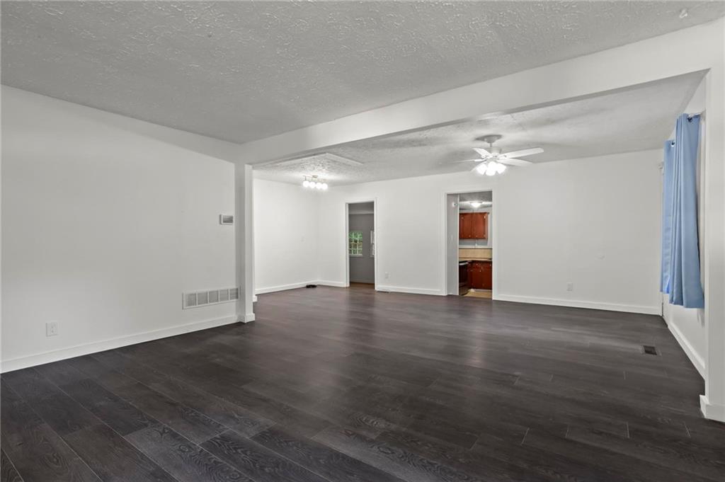 317 Argus Circle Northwest Atlanta, GA 30331 - Photo 6 of 21 a view of an empty room with wooden floor