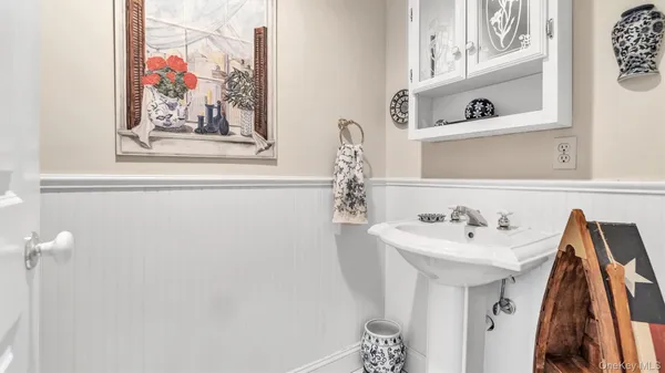 a bathroom with a sink and mirror