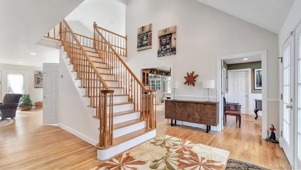 a view of entryway dining room and hall with wooden floor