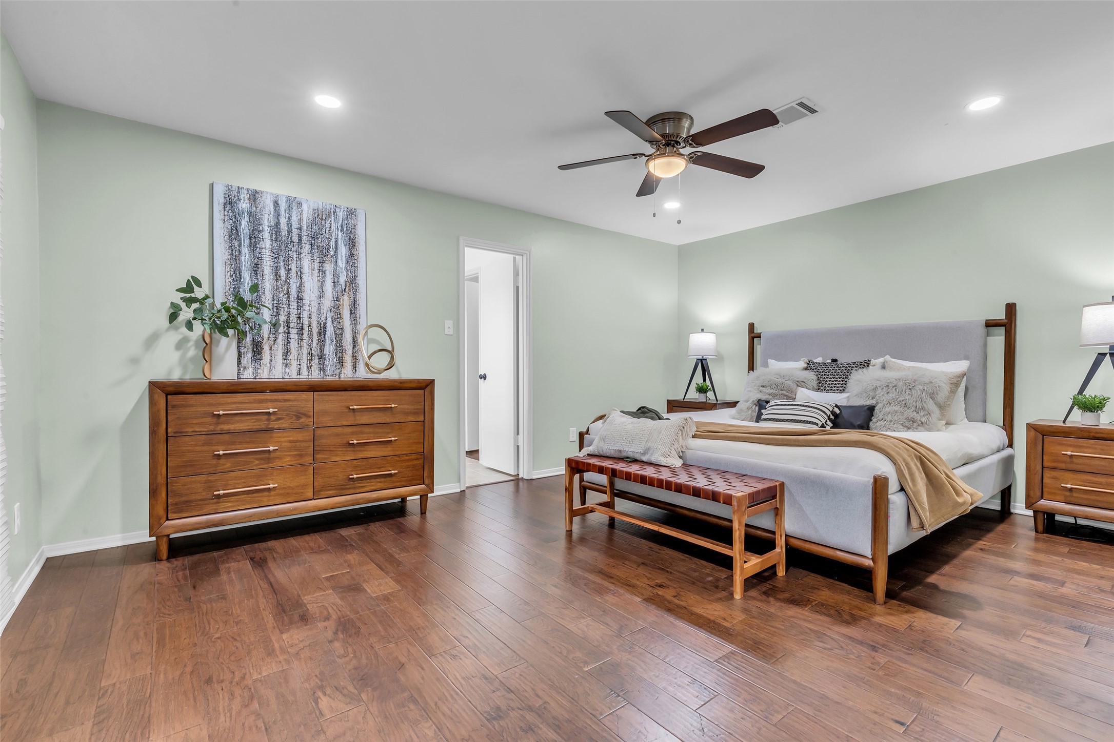 11407 Overbrook Lane Houston, TX 77077 - Photo 20 of 25 Primary bedroom is set apart from the other bedrooms and has private access to back patio.