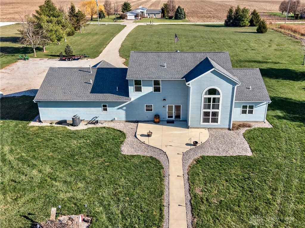 6560 Snyder Road Fletcher, OH 45326 - Photo 60 of 71 This welcoming home offers comfortable living with a spacious patio and ample outdoor area.
