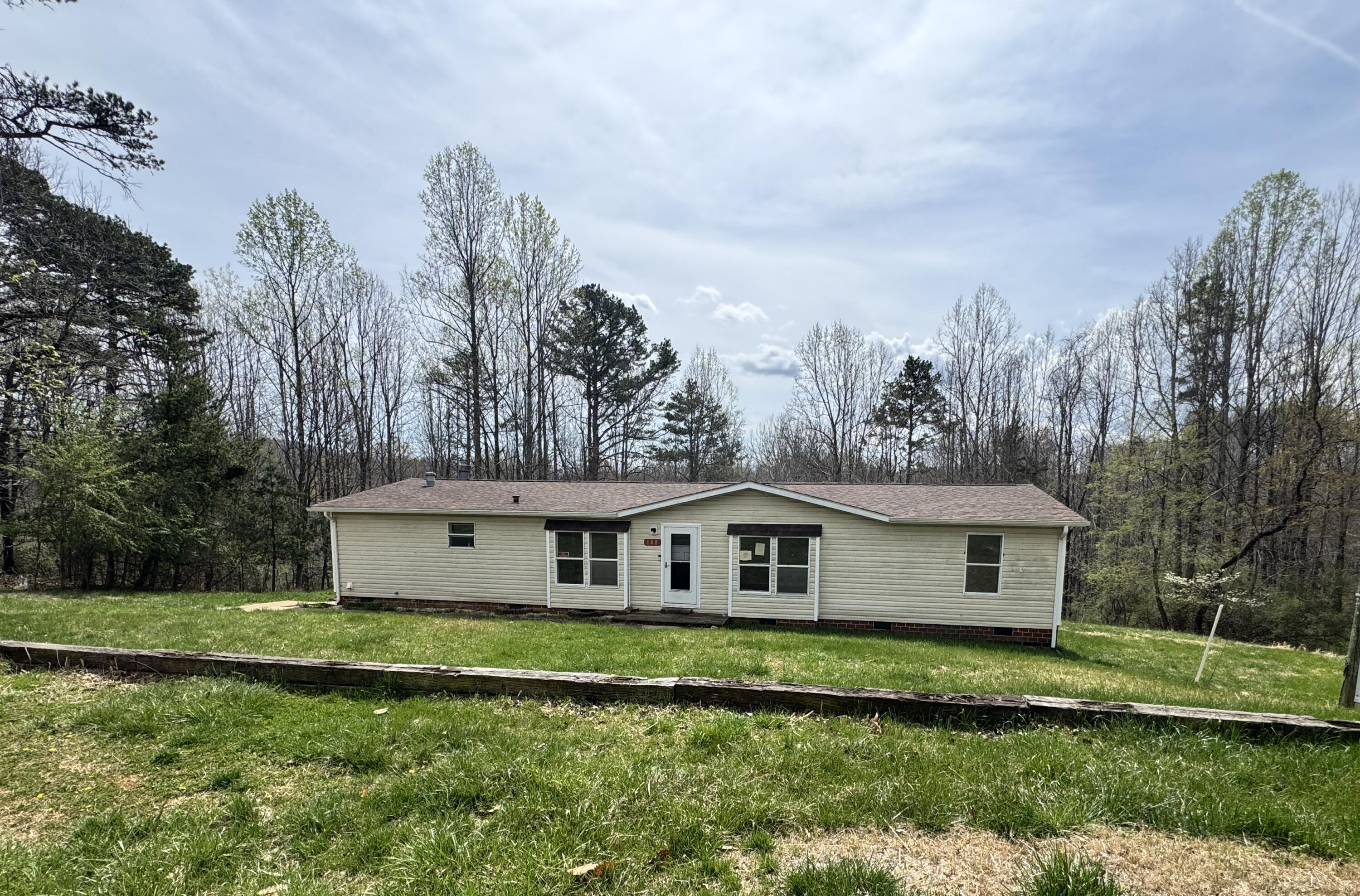 108 Cherokee Lane Thaxton, VA 24174 - Photo 1 of 15 a front view of a house with a yard