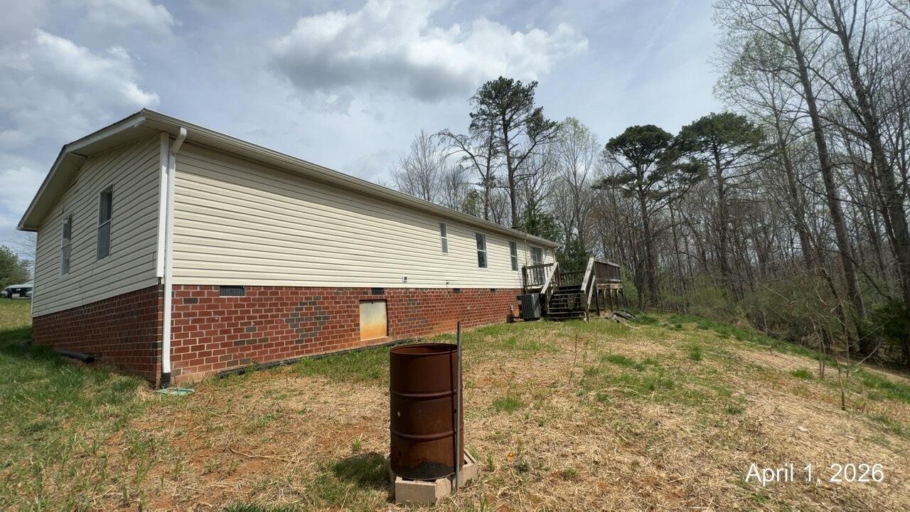 108 Cherokee Lane Thaxton, VA 24174 - Photo 15 of 15 a front view of a house with a yard and garage