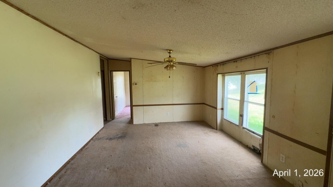 108 Cherokee Lane Thaxton, VA 24174 - Photo 4 of 15 an empty room with a empty space and windows