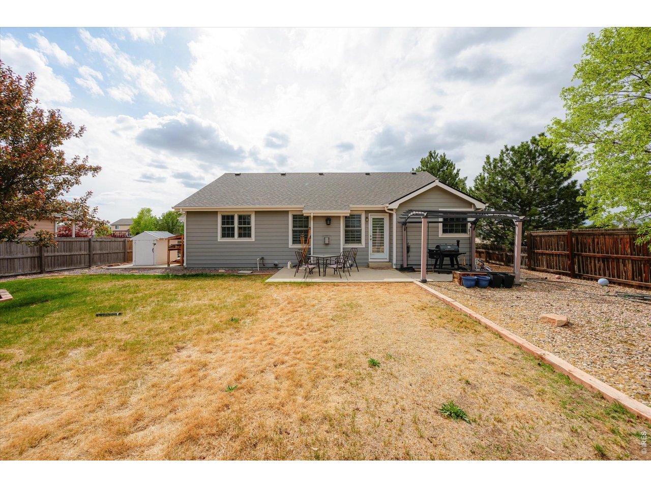 84 Pike Lane Severance, CO 80550 - Photo 12 of 34 a front view of a house with a garden