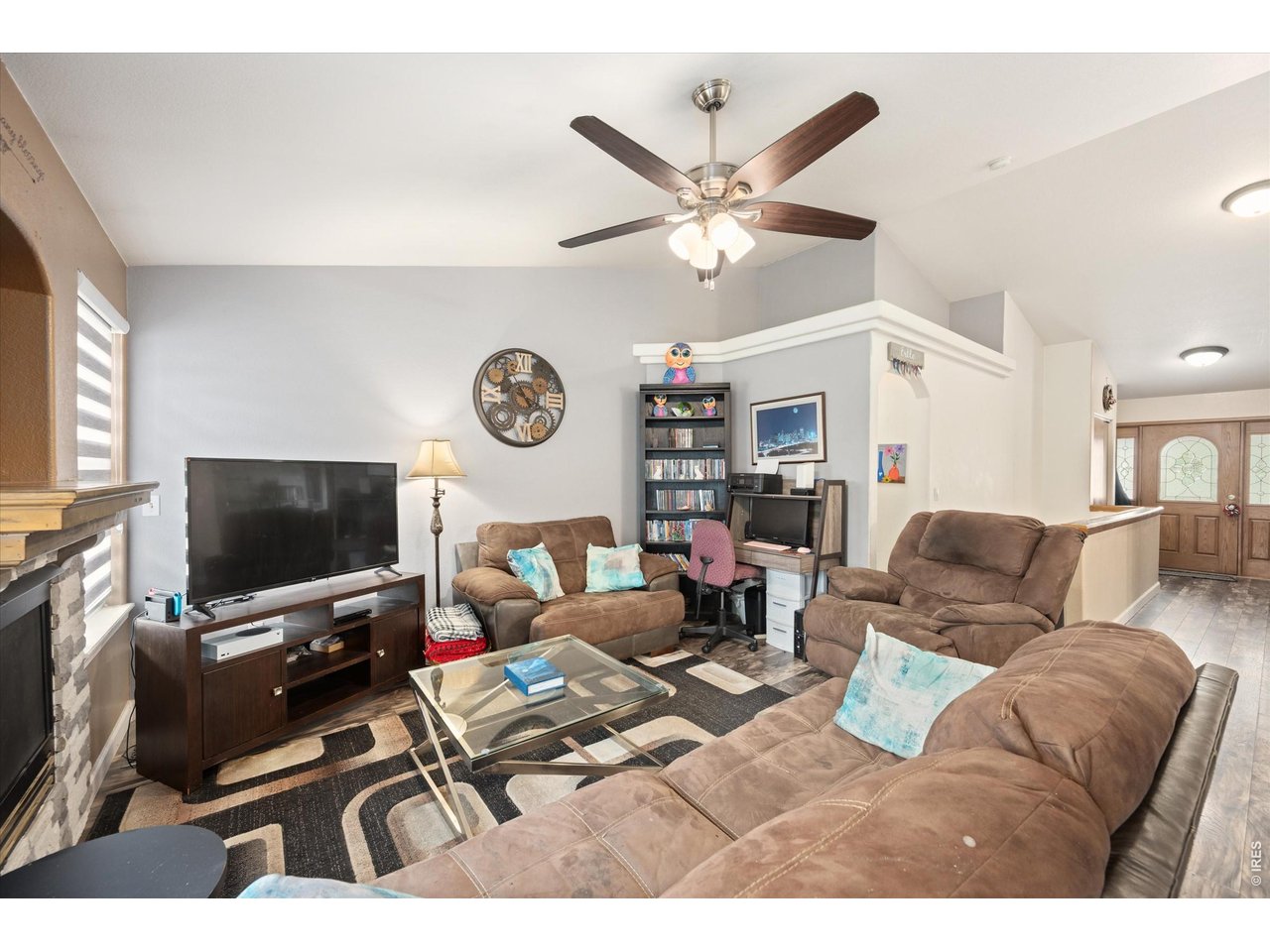 84 Pike Lane Severance, CO 80550 - Photo 14 of 34 a living room with furniture and a flat screen tv