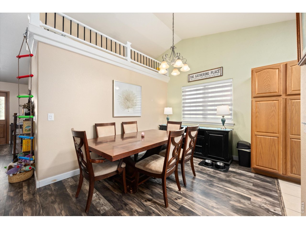 84 Pike Lane Severance, CO 80550 - Photo 17 of 34 a view of a dining room with furniture and wooden floor
