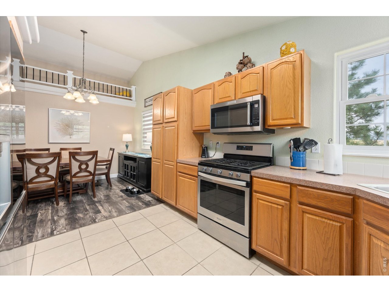 84 Pike Lane Severance, CO 80550 - Photo 20 of 34 a kitchen with stainless steel appliances a stove a sink and a microwave
