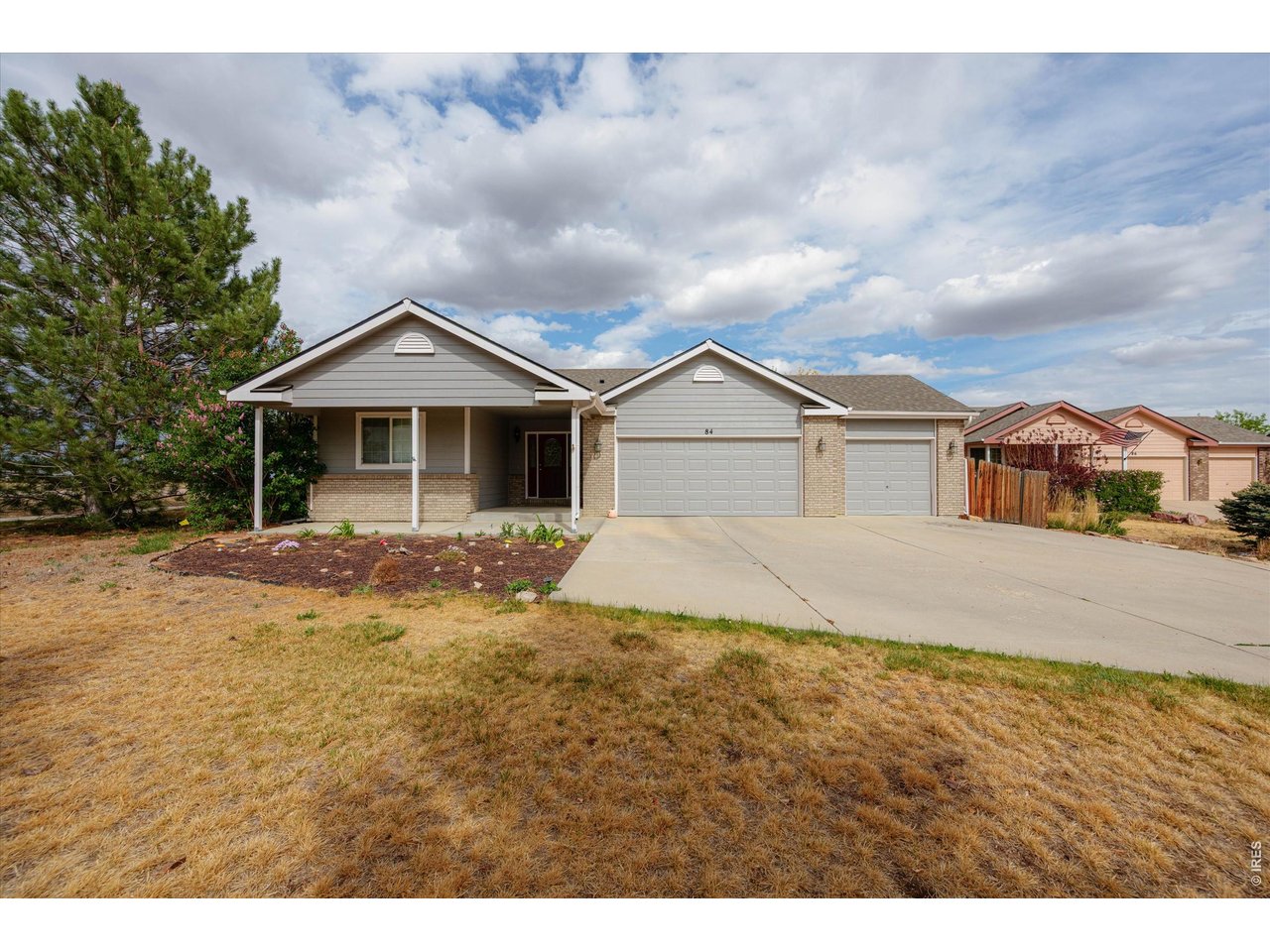 84 Pike Lane Severance, CO 80550 - Photo 2 of 34 a front view of a house with a yard