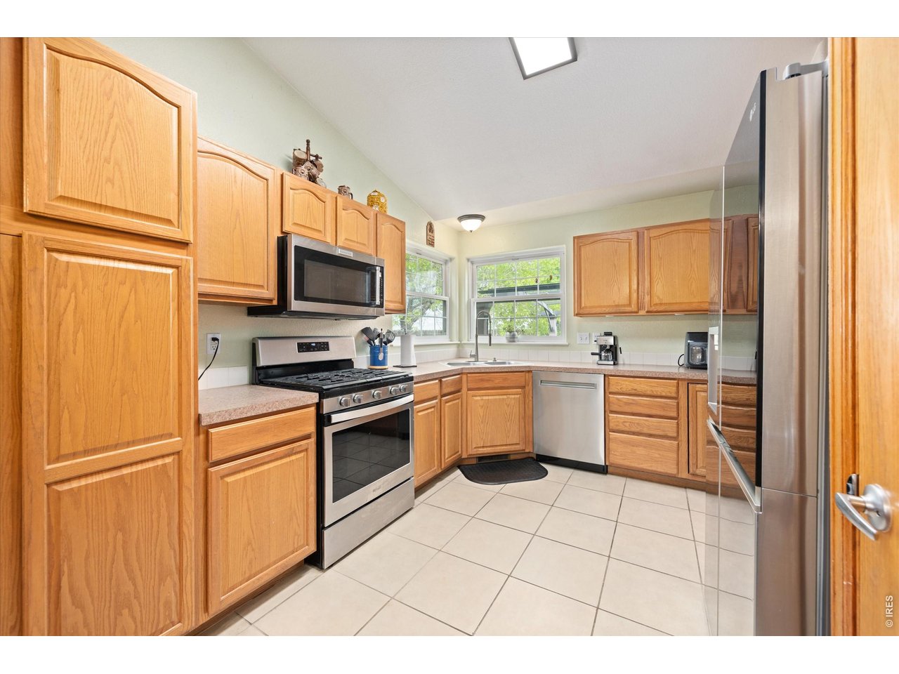 84 Pike Lane Severance, CO 80550 - Photo 21 of 34 a kitchen with stainless steel appliances a refrigerator sink and microwave