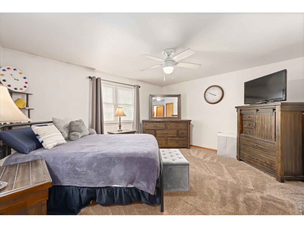 84 Pike Lane Severance, CO 80550 - Photo 24 of 34 a living room with furniture and a flat screen tv