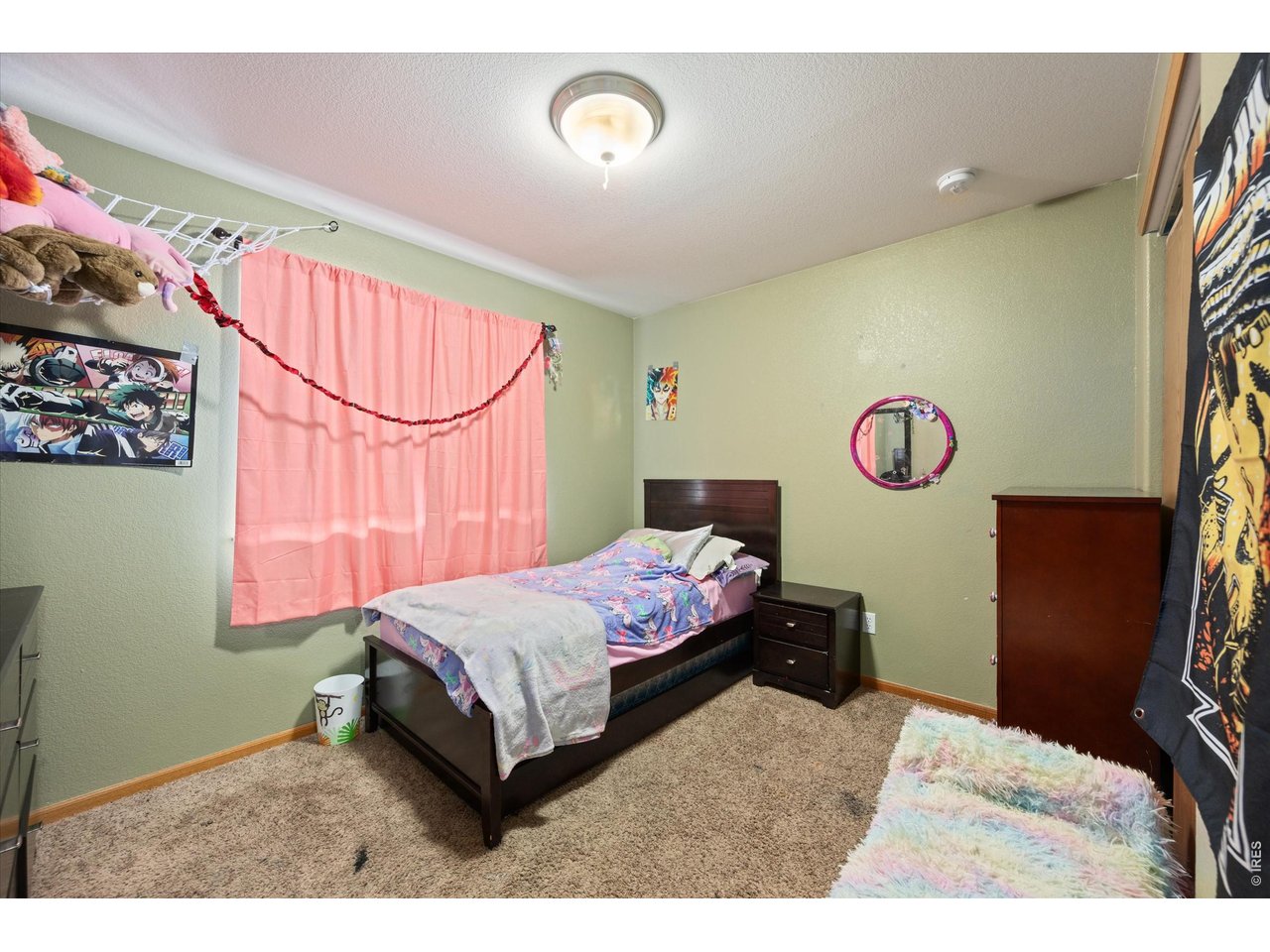 84 Pike Lane Severance, CO 80550 - Photo 29 of 34 a bedroom with a bed and a window
