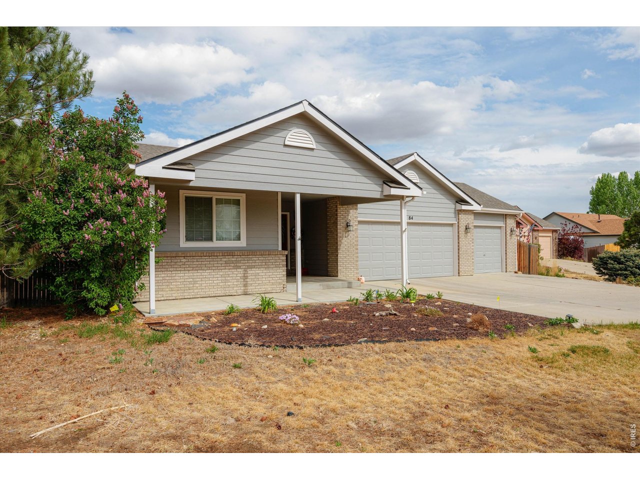 84 Pike Lane Severance, CO 80550 - Photo 3 of 34 a view of a house with a yard